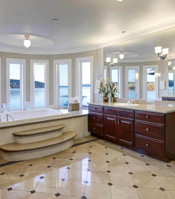 Remodeled bathroom showing tub, flooring, and vanity